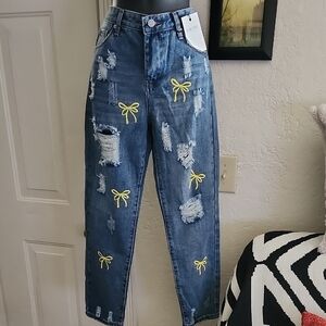 Stylish Blue Distressed Jeans with Yellow Accents